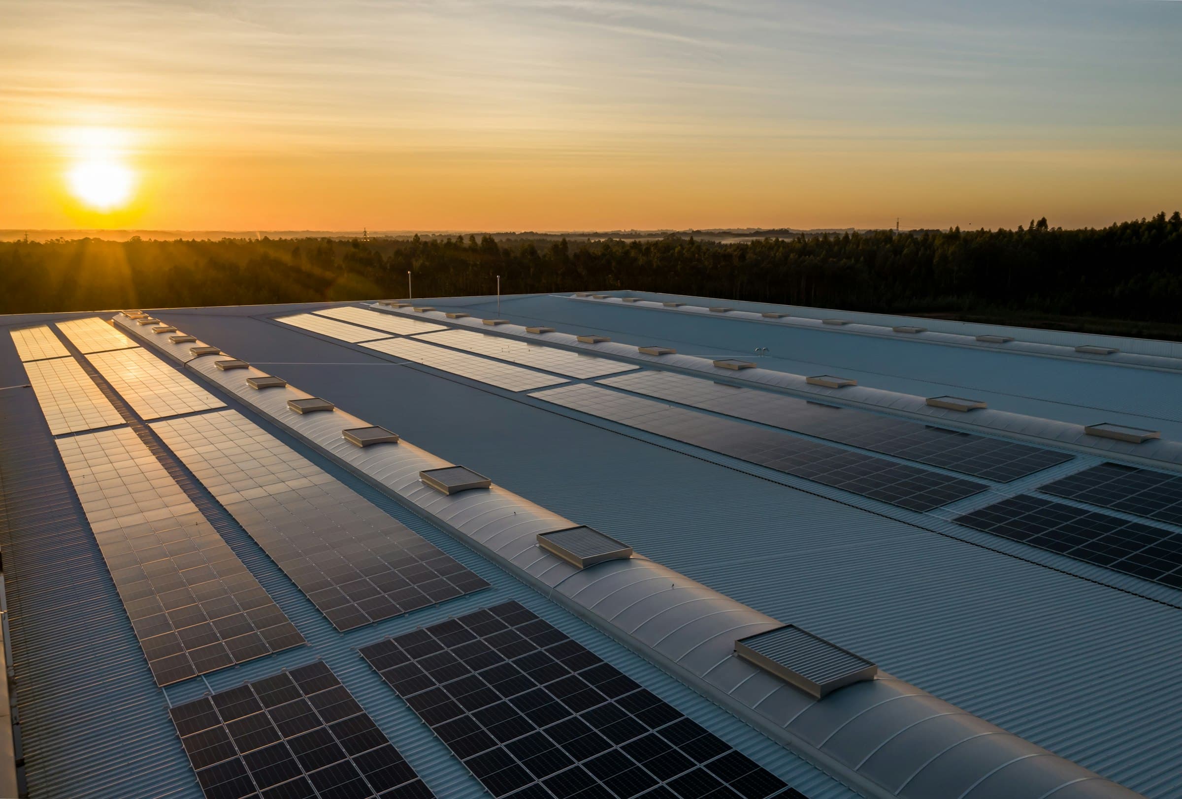 Rooftop solar array at sunset